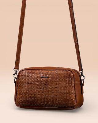 Front angled view of Afef Medium cuoio leather crossbody bag by Benheart.