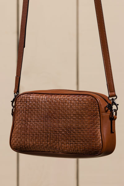 Back angled view of Afef Medium cuoio leather crossbody bag by Benheart.