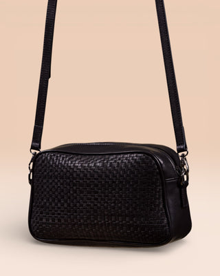 Back angled view of Afef Medium black leather crossbody bag by Benheart.