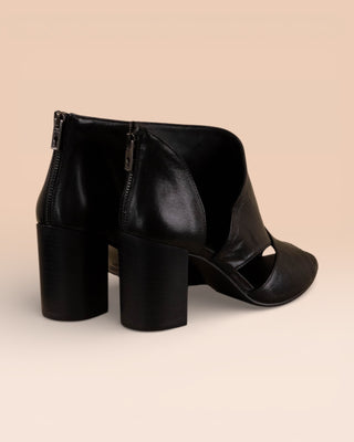 Rear angled view of Aria V443 women's black buffalo leather block heel sandals by Benheart, showing heel and back design.