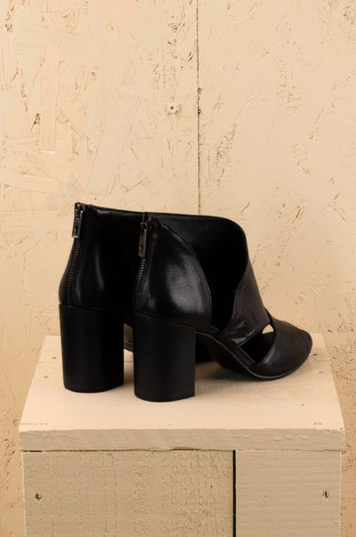 Rear angled view of Aria V443 women's black buffalo leather block heel sandals by Benheart, showing heel and back design.