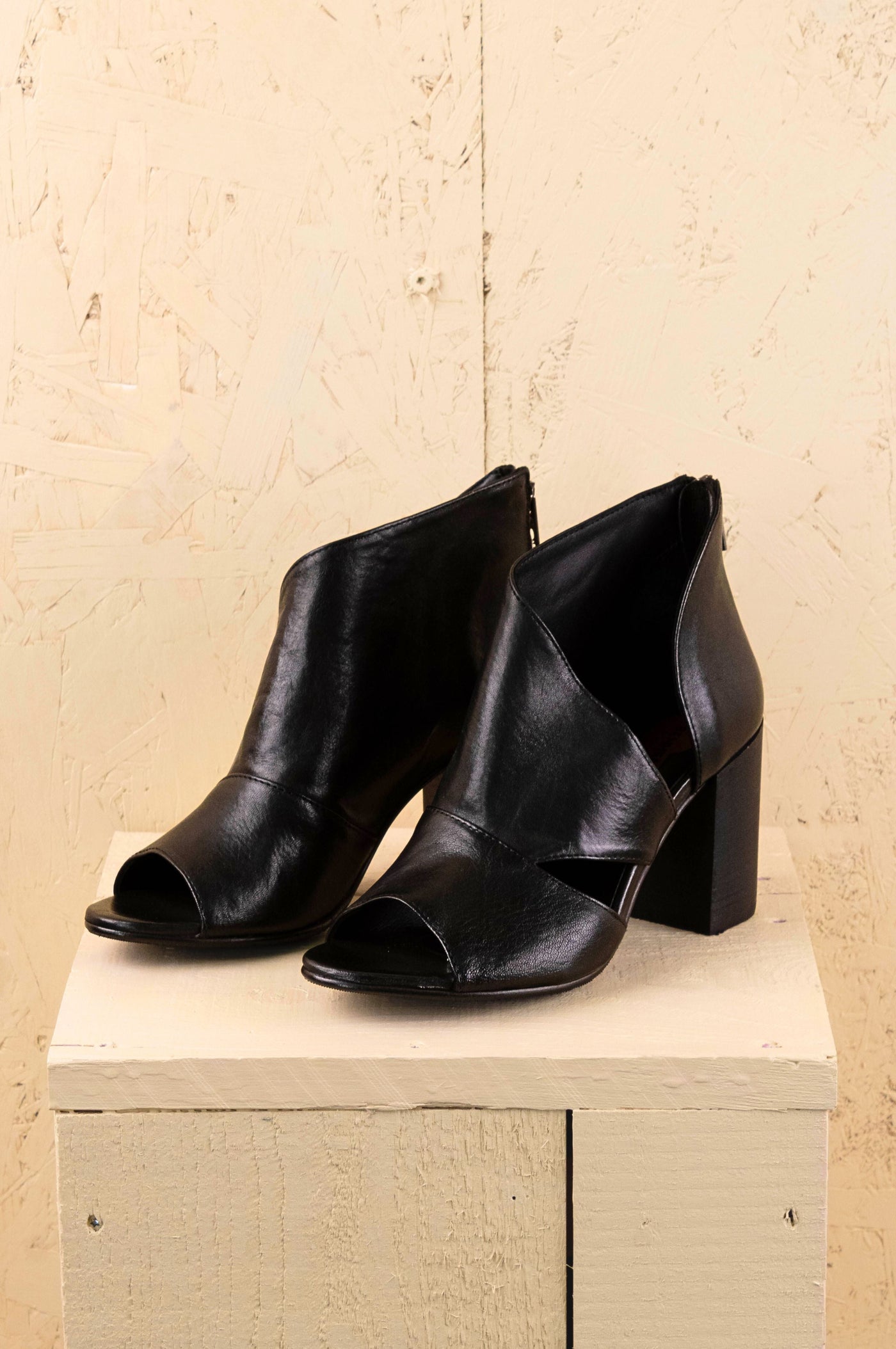 Front view of Aria V443 women's black buffalo leather block heel sandals with open toe and overlapping front design.