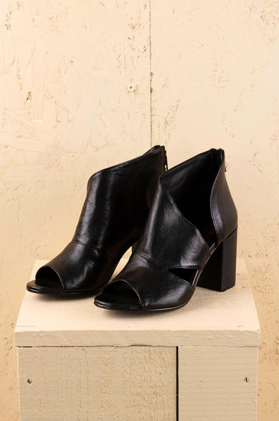 Front view of Aria V443 women's black buffalo leather block heel sandals with open toe and overlapping front design.