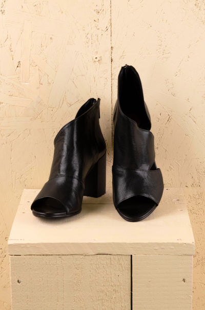 Front view of Aria V443 women's black buffalo leather block heel sandals with open toe and overlapping front design.