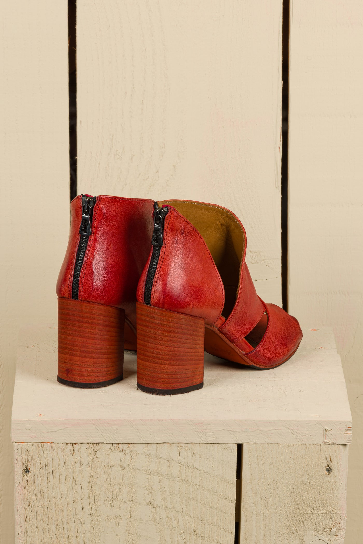 Rear-angled view of Aria V443 women's porpora buffalo leather sandals, showing heel and back design