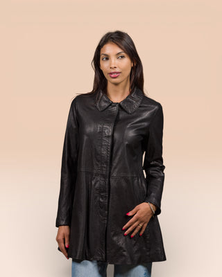 Front view of a model wearing the Mini women's leather jacket in black, handcrafted in Italy by Benheart, worn closed.