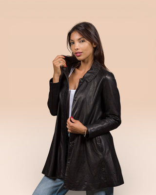 Front angled view of a model wearing the Mini Women’s black leather jacket by Benheart, handcrafted in Italy, worn partially