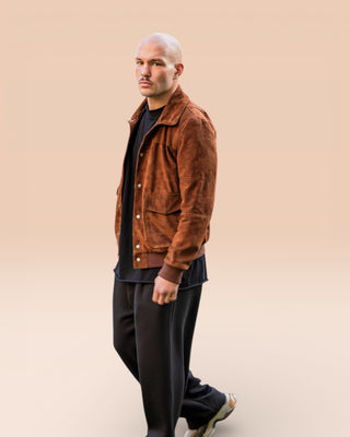 Full-body shot of a model wearing an open suede jacket by Benheart