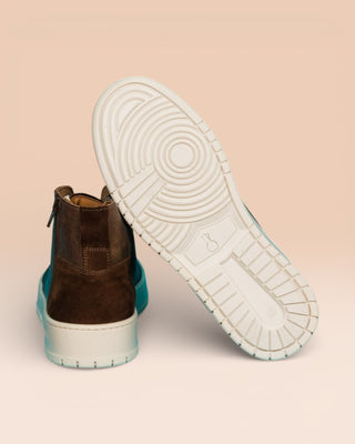 Rear view of one Bonetti 8473 unisex brown leather high-top sneaker, while the other is angled to display the rubber sole.