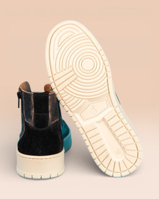 Rear view of one Bonetti 8473 unisex black beige leather high-top sneaker, while the other is angled