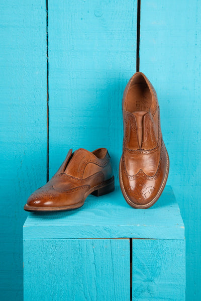 Front angled and top view of Benheart Colombo 7543 men’s cerro leather brogue slip-on shoes.