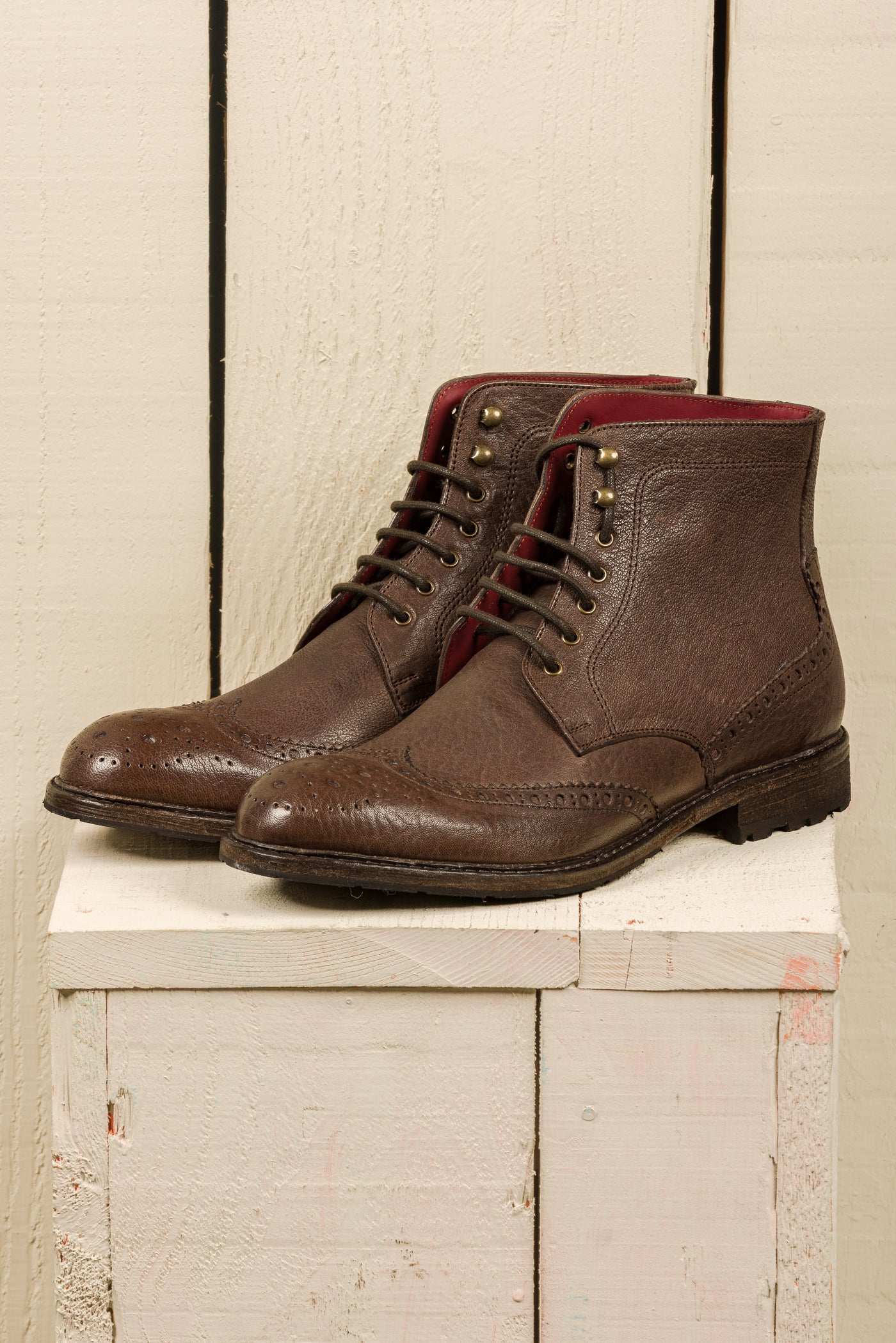 Front angled view of Benheart Daniel men’s brown leather lace-up brogue ankle boots with wingtip design