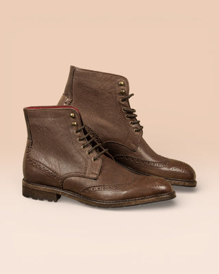 Side view of a pair of Daniel men’s leather lace-up brogue ankle boots with wingtip design, handmade by Benheart in brown