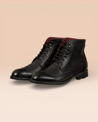 Front angled view of Benheart Daniel men’s black leather lace-up brogue ankle boots with wingtip design.
