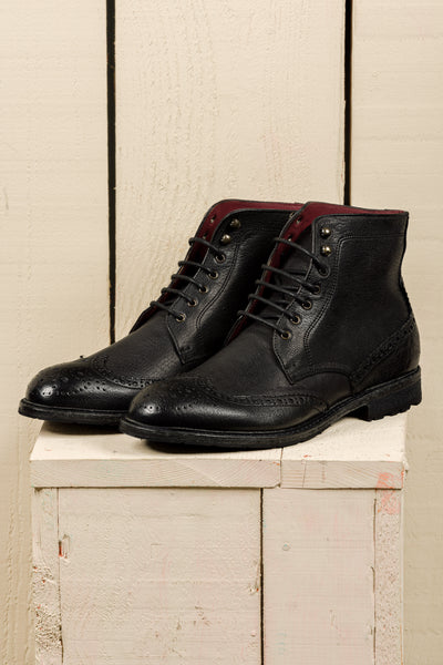 Front angled view of Benheart Daniel men’s black leather lace-up brogue ankle boots with wingtip design.