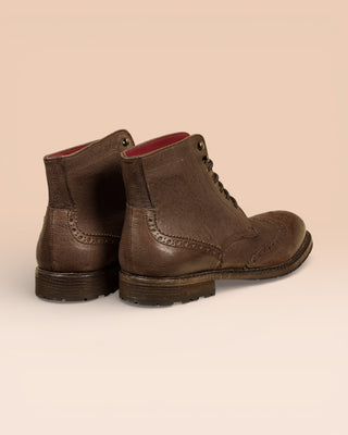 Rear view of a pair of Benheart Daniel men’s brown leather lace-up brogue ankle boots with wingtip design.
