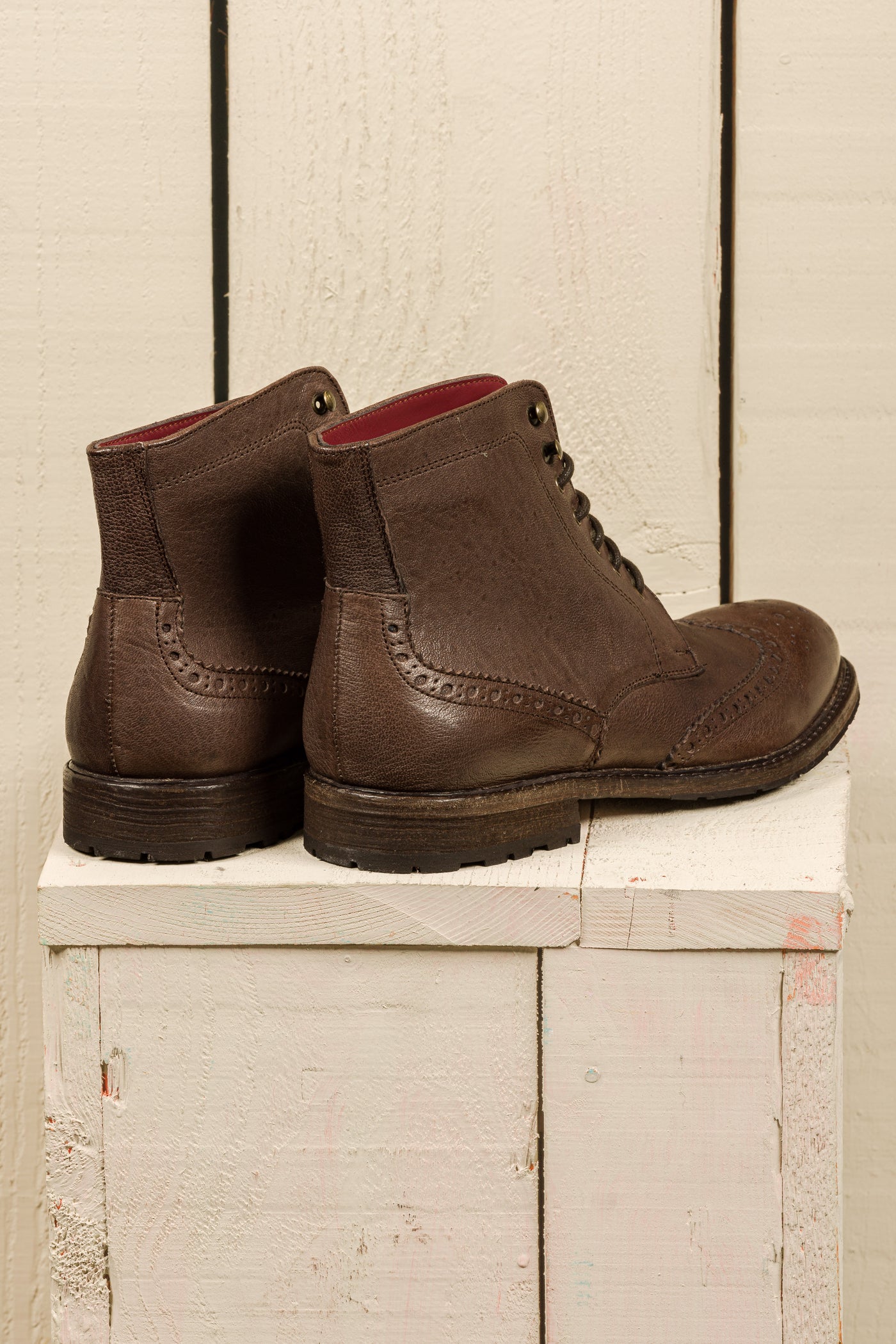 Rear view of a pair of Benheart Daniel men’s brown leather lace-up brogue ankle boots with wingtip design.
