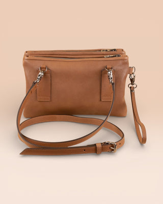 Rear view of the Benheart Desert Pochette Borchiata in Cuoio color.