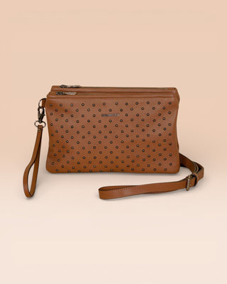 Front view of the Benheart Desert Pochette Borchiata in Cuoio color, slightly angled to show the two zip pockets