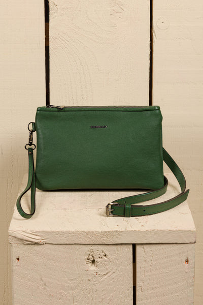 Front view of the Benheart Desert Pochette leather clutch in green, highlighting the two zippered compartments and adjustable shoulder strap.