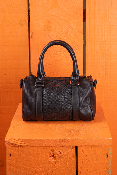 Front view of Benheart Dom Intrecciata black leather bag, featuring woven central panel.