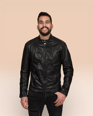 Model wearing the Driss men's leather jacket in black, handcrafted by Benheart in Florence, Italy.
