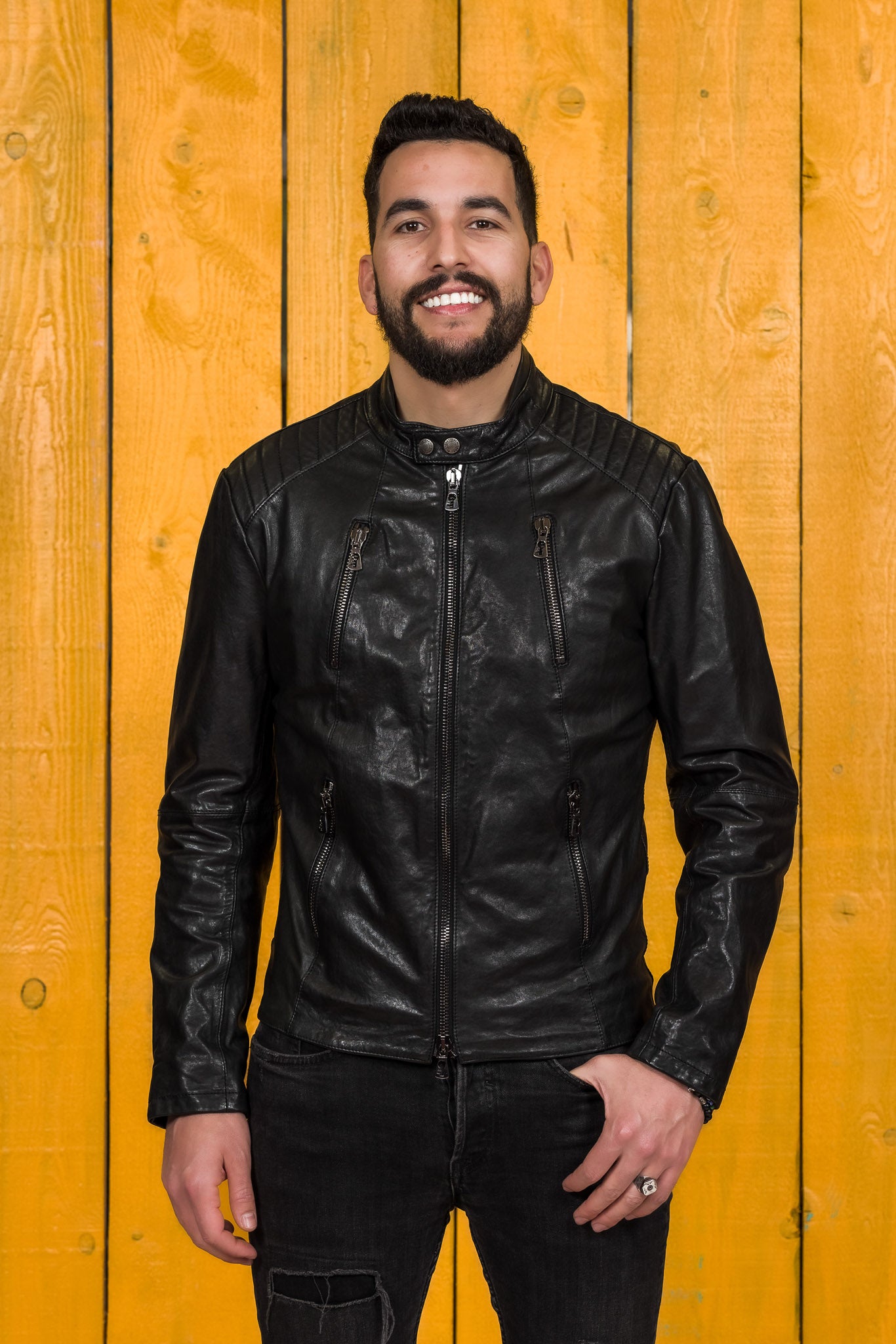 Model wearing the Driss men's leather jacket in black, handcrafted by Benheart in Florence, Italy.
