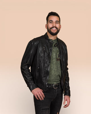 Front view of the Driss men's leather jacket in black, worn open by the model.
