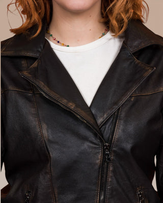 Close-up of Fede Special beige women's leather biker jacket, closed, showing neckline and zipper.