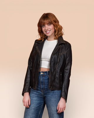 Model wearing Fede Special beige women's leather biker jacket, open, front 3/4 view.