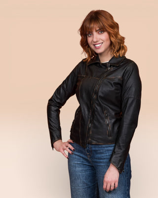 Model wearing Fede Special beige women's leather biker jacket, closed, front 3/4 view.