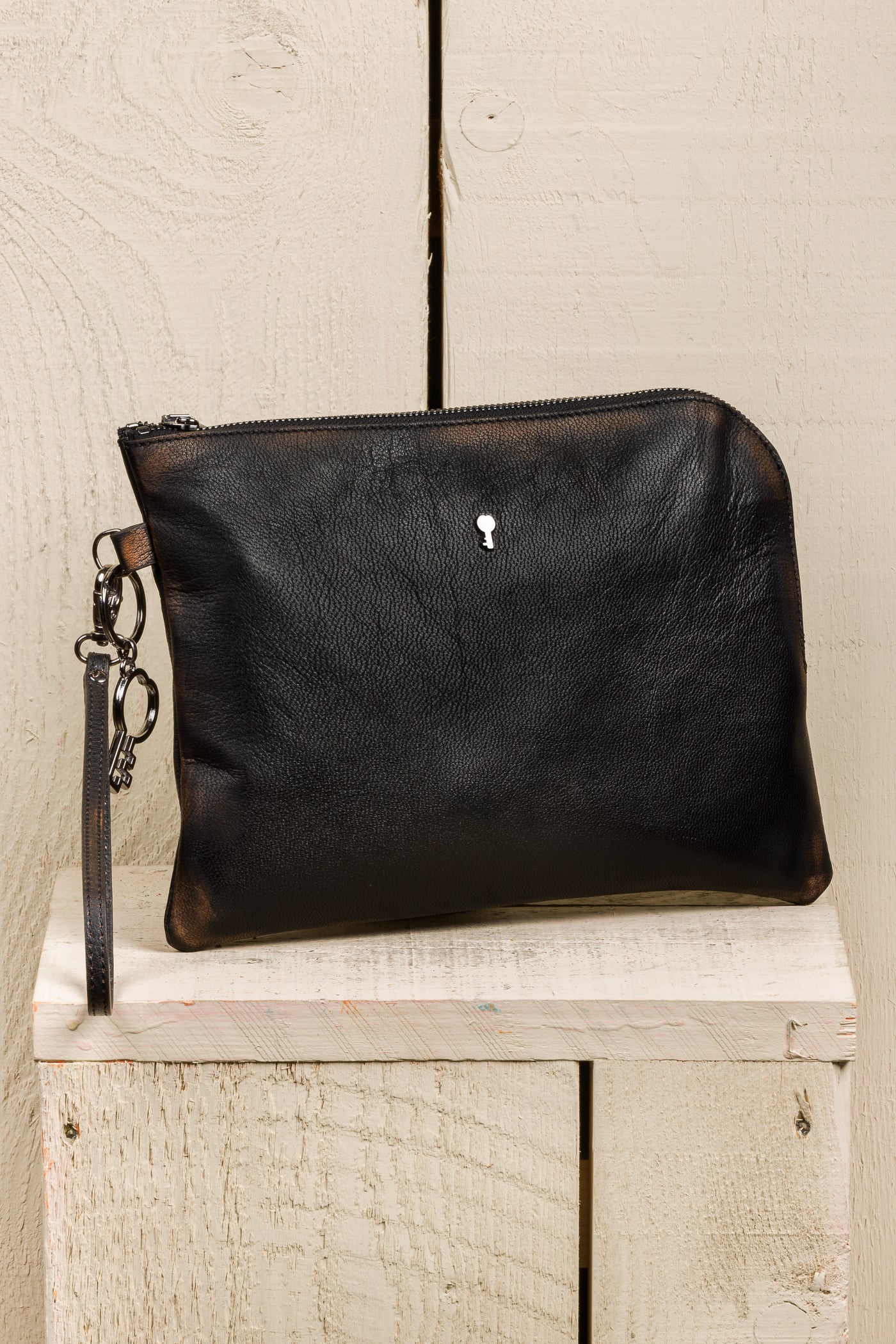 Benheart Gigi black beige leather pouch, handmade in Italy, angled front view.