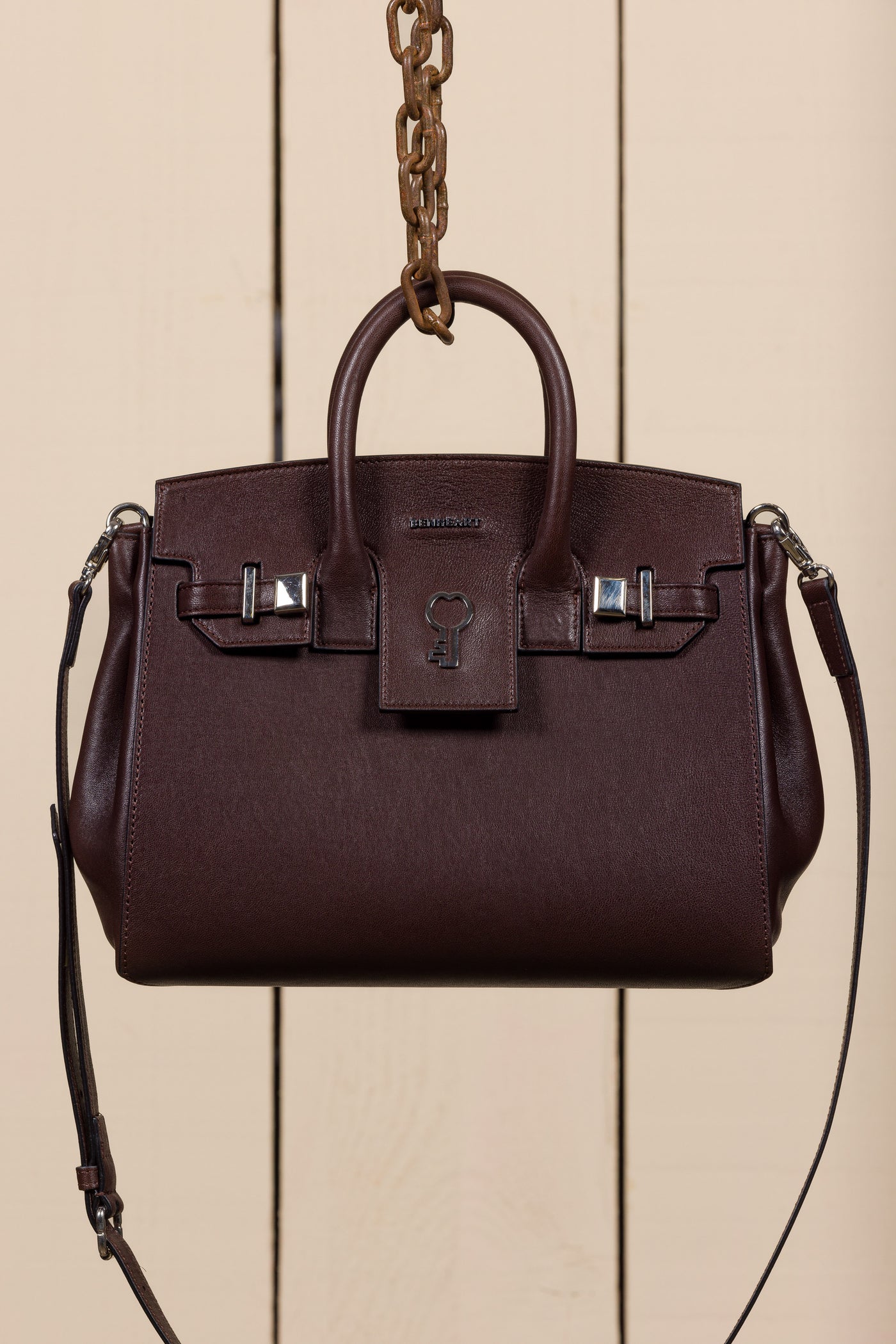 Front view of Ginevra Small chocolate lamb leather bag with gold Benheart logo, handcrafted in Florence.