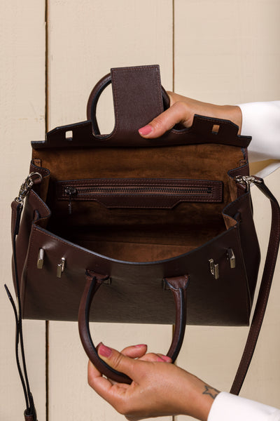 Ginevra Small Benheart chocolate lamb leather bag, front angled view showing open suede brown interior.