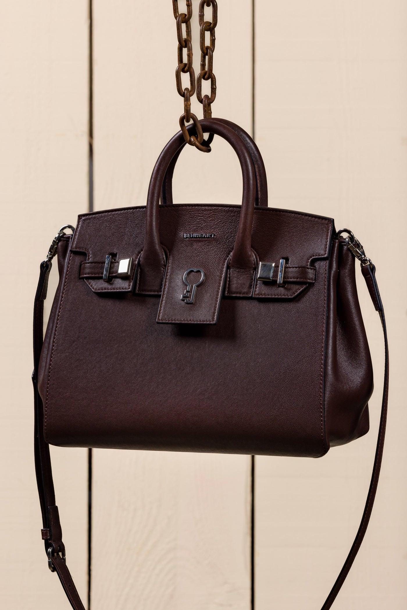 Ginevra Small chocolate lamb leather bag, front three-quarter view with gold Benheart logo.