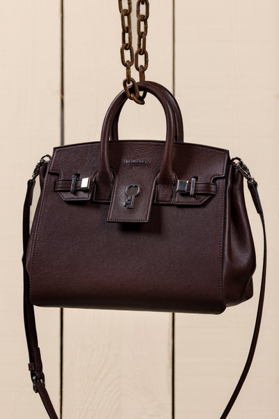 Ginevra Small chocolate lamb leather bag, front three-quarter view with gold Benheart logo.
