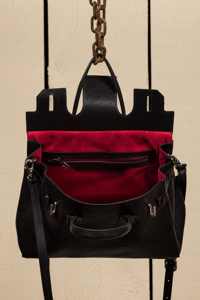 Ginevra Small Benheart black lamb leather bag, front angled view showing open red interior.
