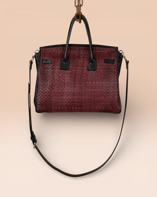 Rear view of Benheart Ginevra Small Intrecciata woven lamb leather bag in plum.