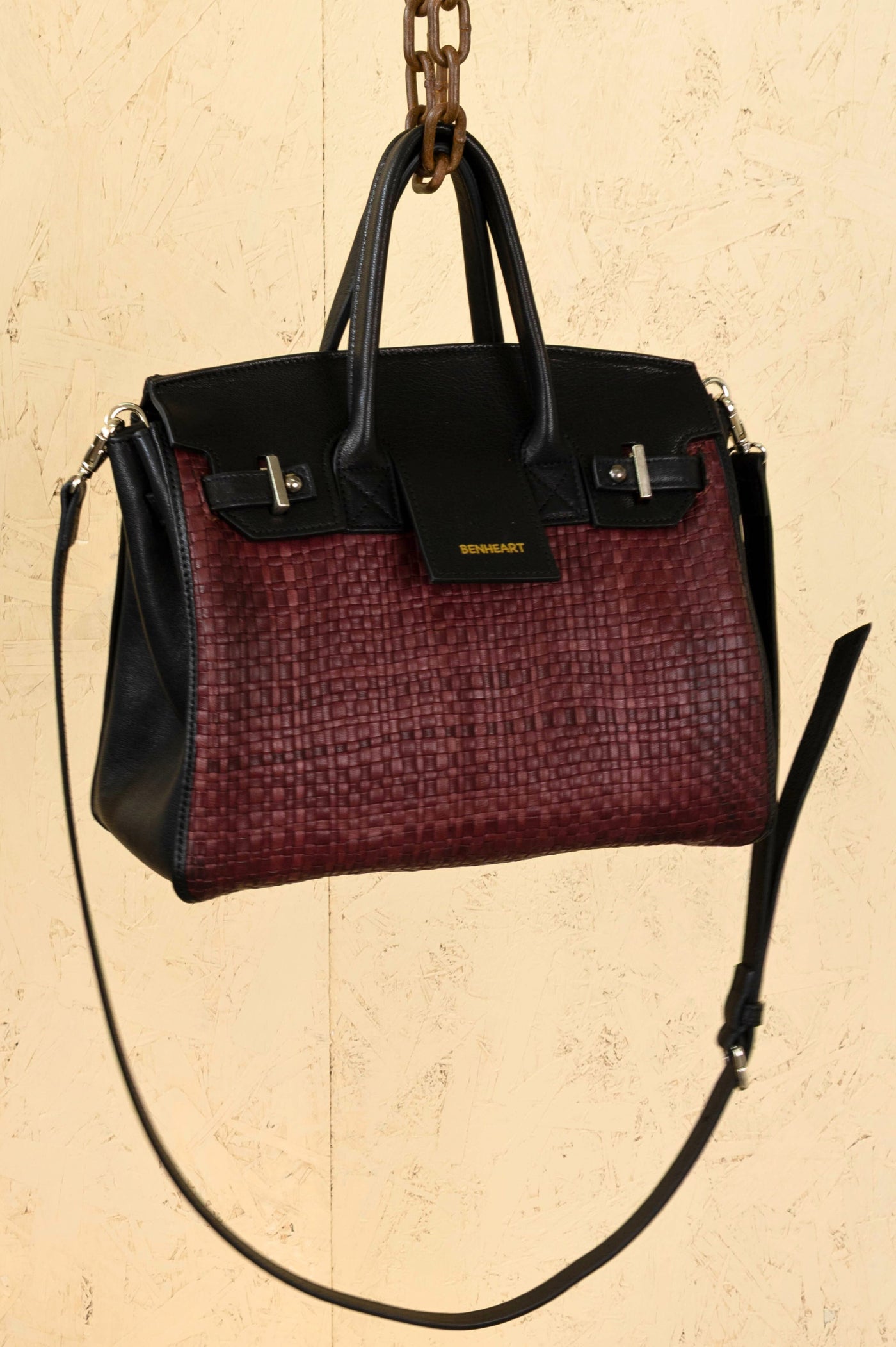Front angled view of Benheart Ginevra Small Intrecciata woven lamb leather bag in plum.