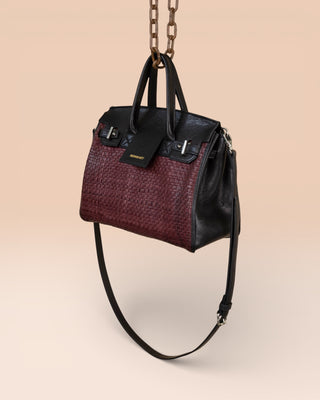 Front angled view of Benheart Ginevra Small Intrecciata woven lamb leather bag in plum.