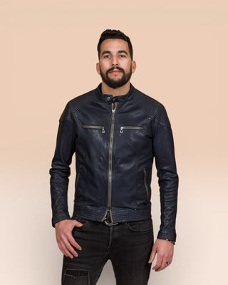 Front view of a model wearing the blue Hich leather jacket by Benheart, handcrafted in Florence, Italy.