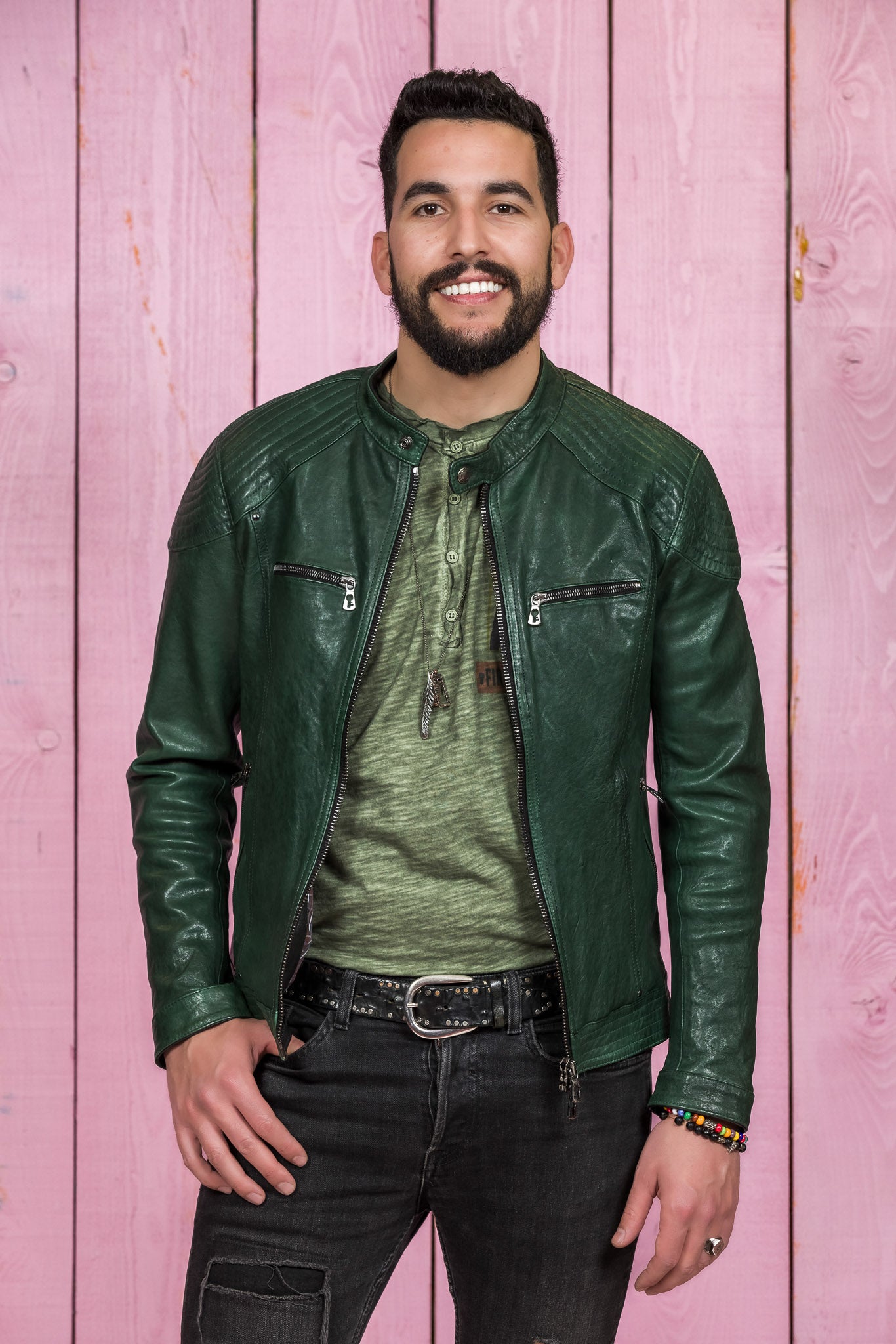 Front view of a model wearing the green Hich Limited leather jacket by Benheart, worn open.