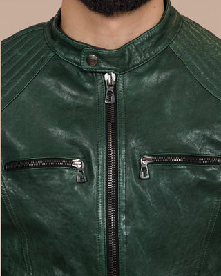 Close-up of the green Hich Limited jacket’s front zipper and chest pockets with Benheart logo-shaped zipper pulls.