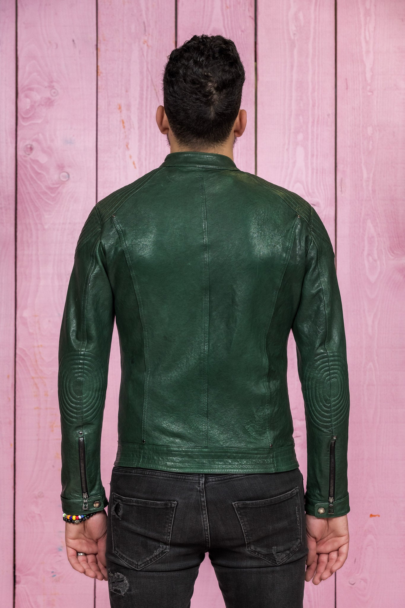 Back view of a model wearing the green Hich Limited leather jacket by Benheart.