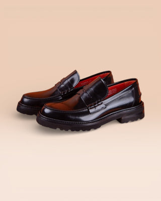 Benheart Ida Mocassino women’s penny loafers in polished black cordovan leather, front angled view.