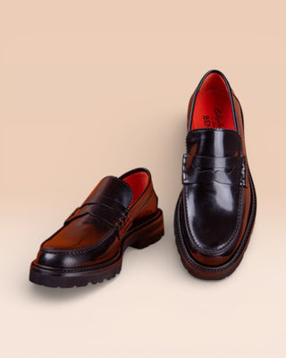 Benheart Ida Mocassino women’s penny loafers in polished black cordovan leather, front angled and top view.