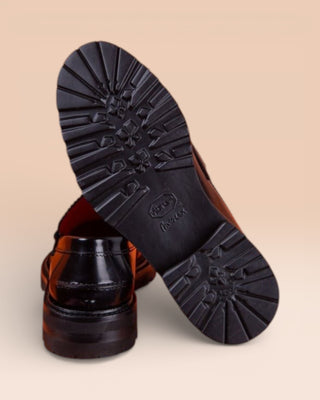 Benheart Ida Mocassino women’s penny loafers in polished black cordovan leather, rear view with one shoe showing the heel