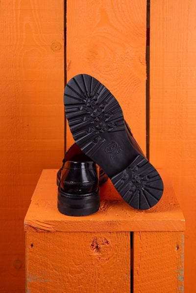 Benheart Ida Mocassino women’s penny loafers in polished black cordovan leather, rear view with one shoe showing the heel