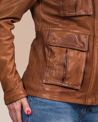 Detail of right pocket on Ilary cuoio leather jacket by Benheart, worn by model.