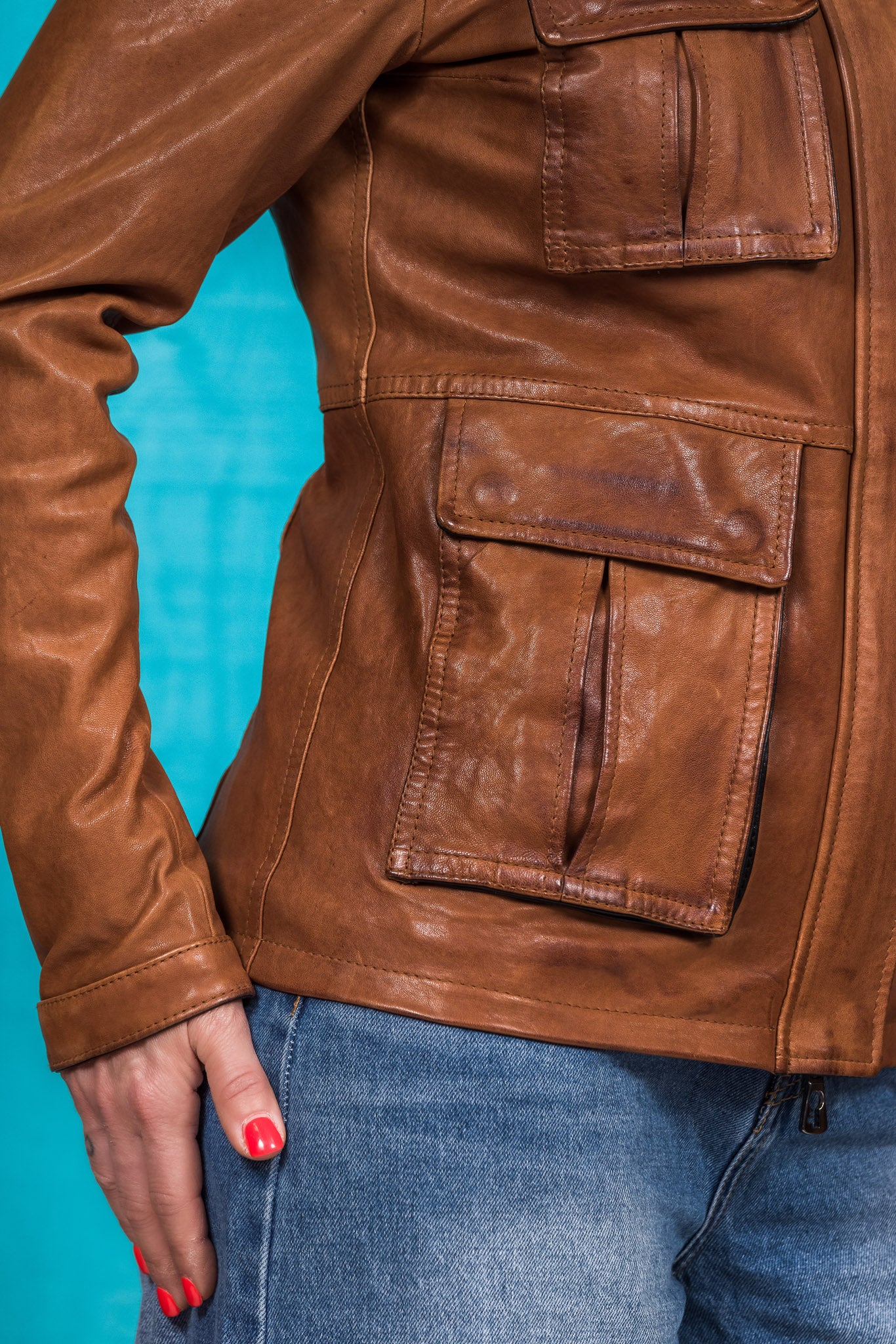 Detail of right pocket on Ilary cuoio leather jacket by Benheart, worn by model.